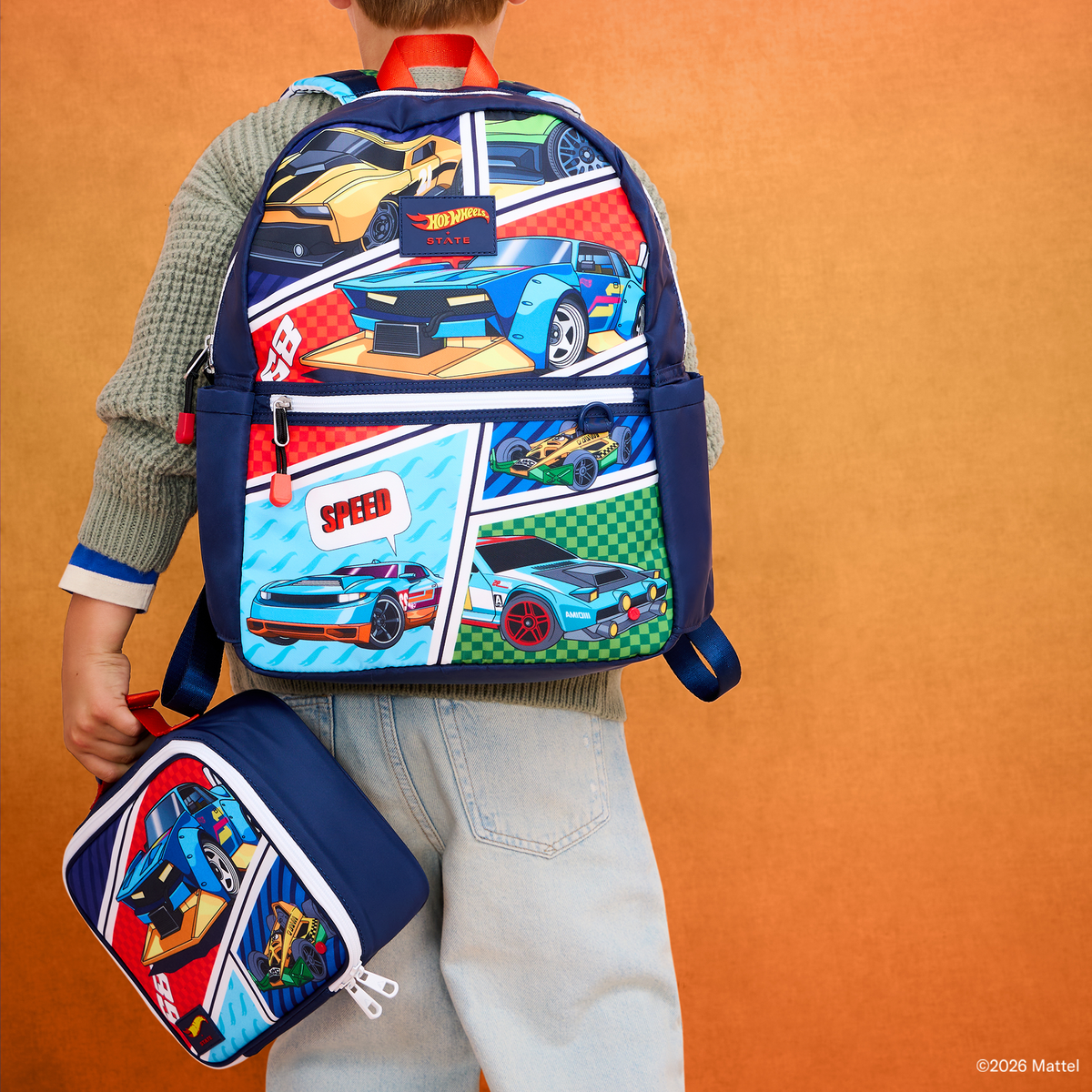 Boy wearing STATE x Hot Wheels™ Kane Backpack Comic