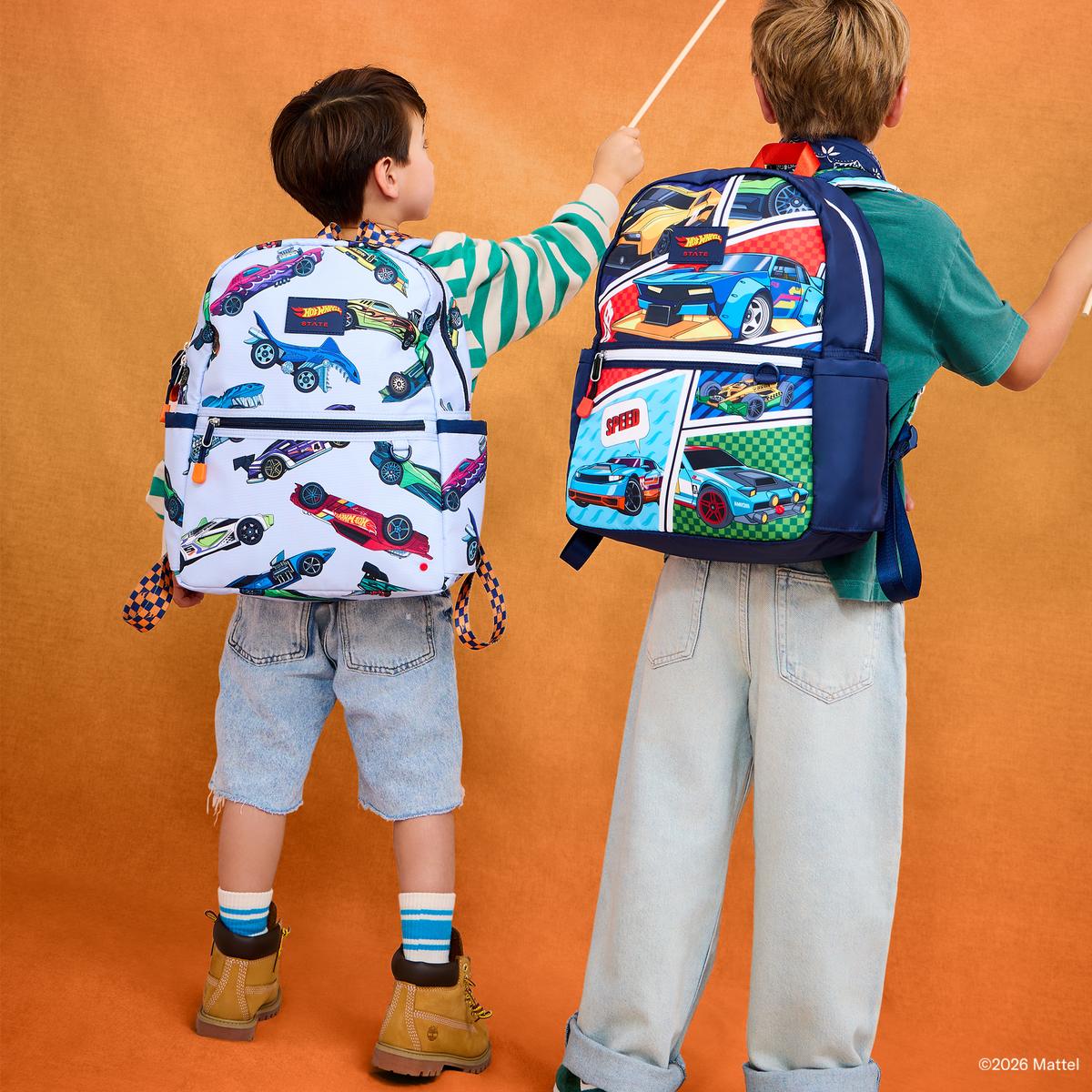 Boy holding STATE x Hot Wheels Kane Backpack Hot Wheels Cars 