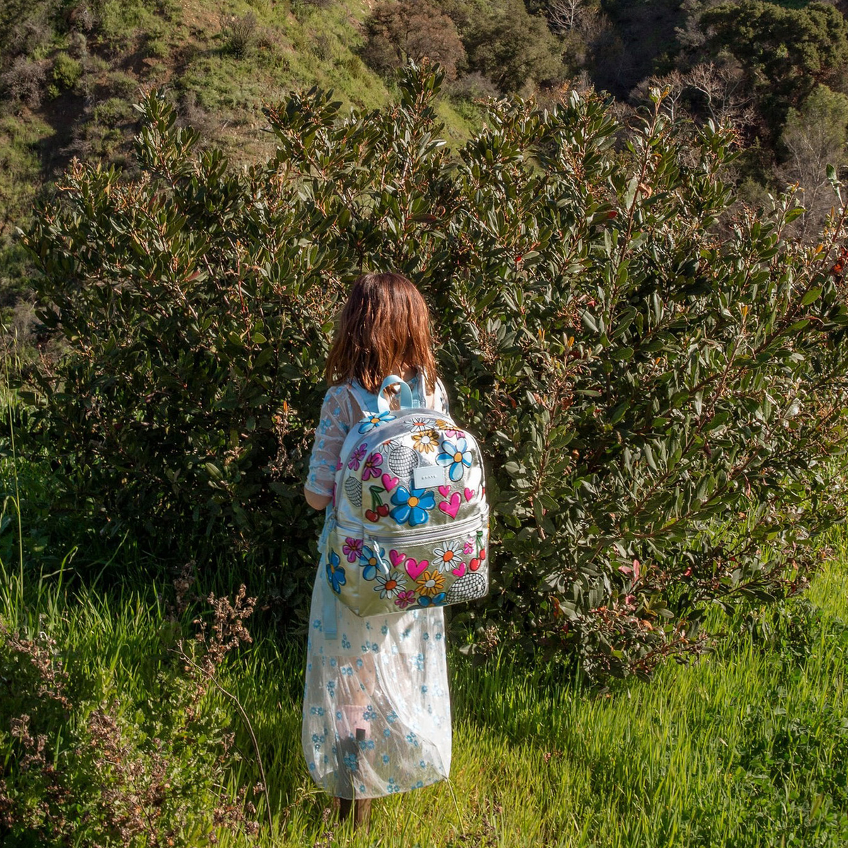 Girl wearing STATE Bags Kane Backpack Metallic Graffiti 