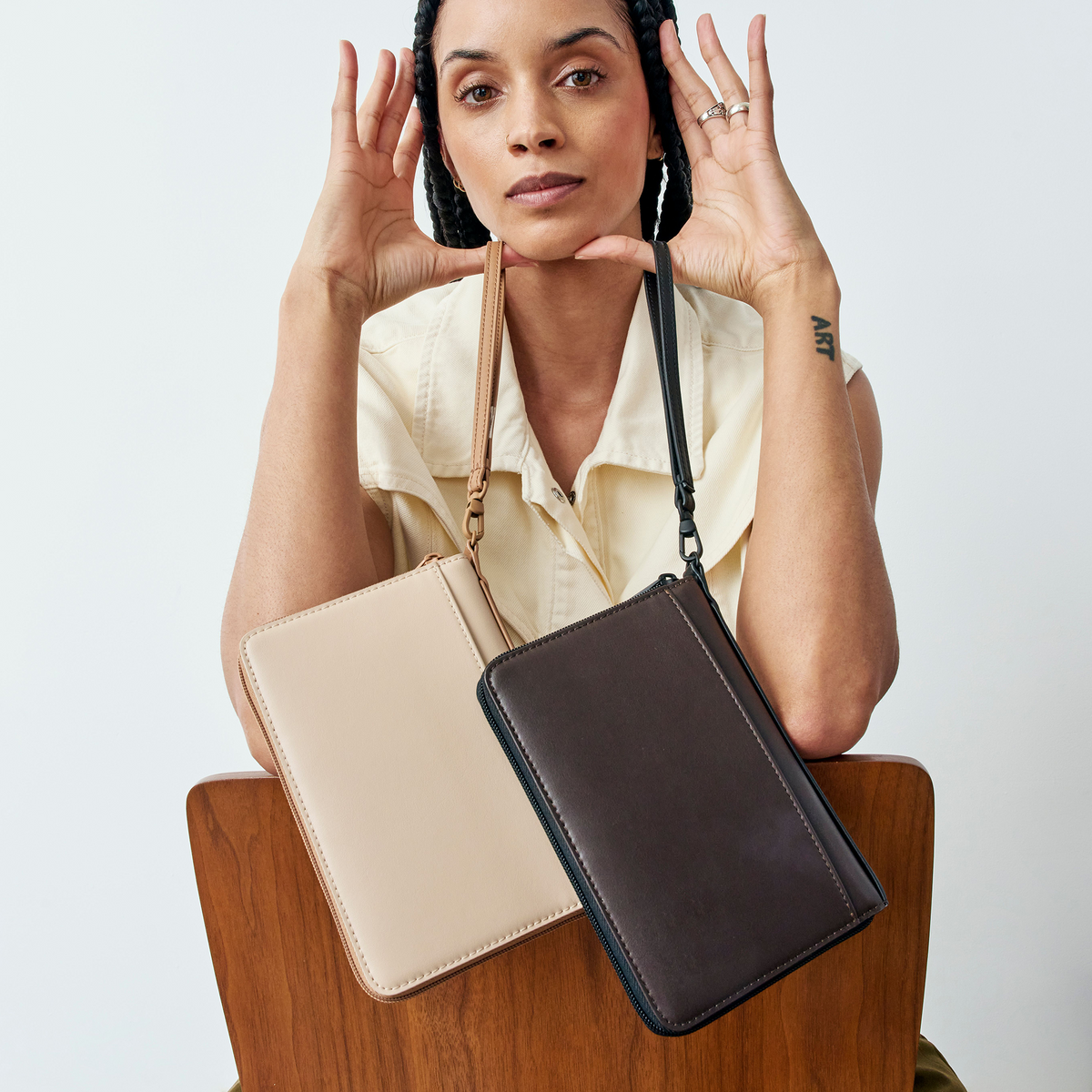 woman holding STATE Bags Passport Holder Brown and Sand 