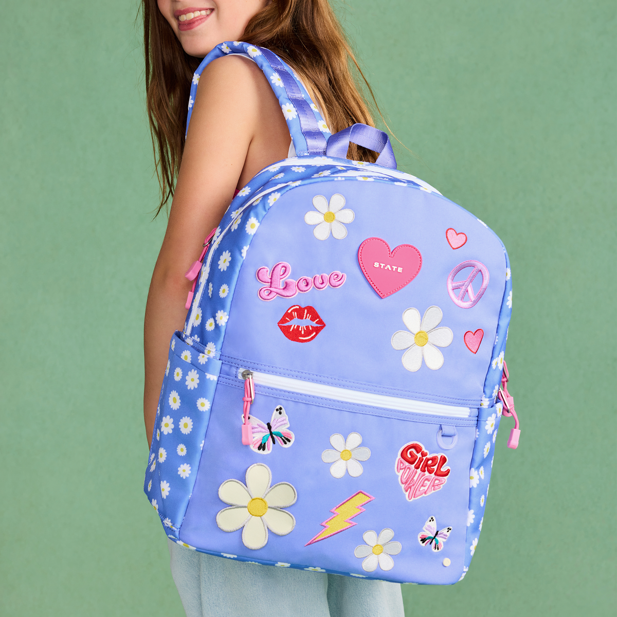 girl wearing STATE Bags girl power backpack