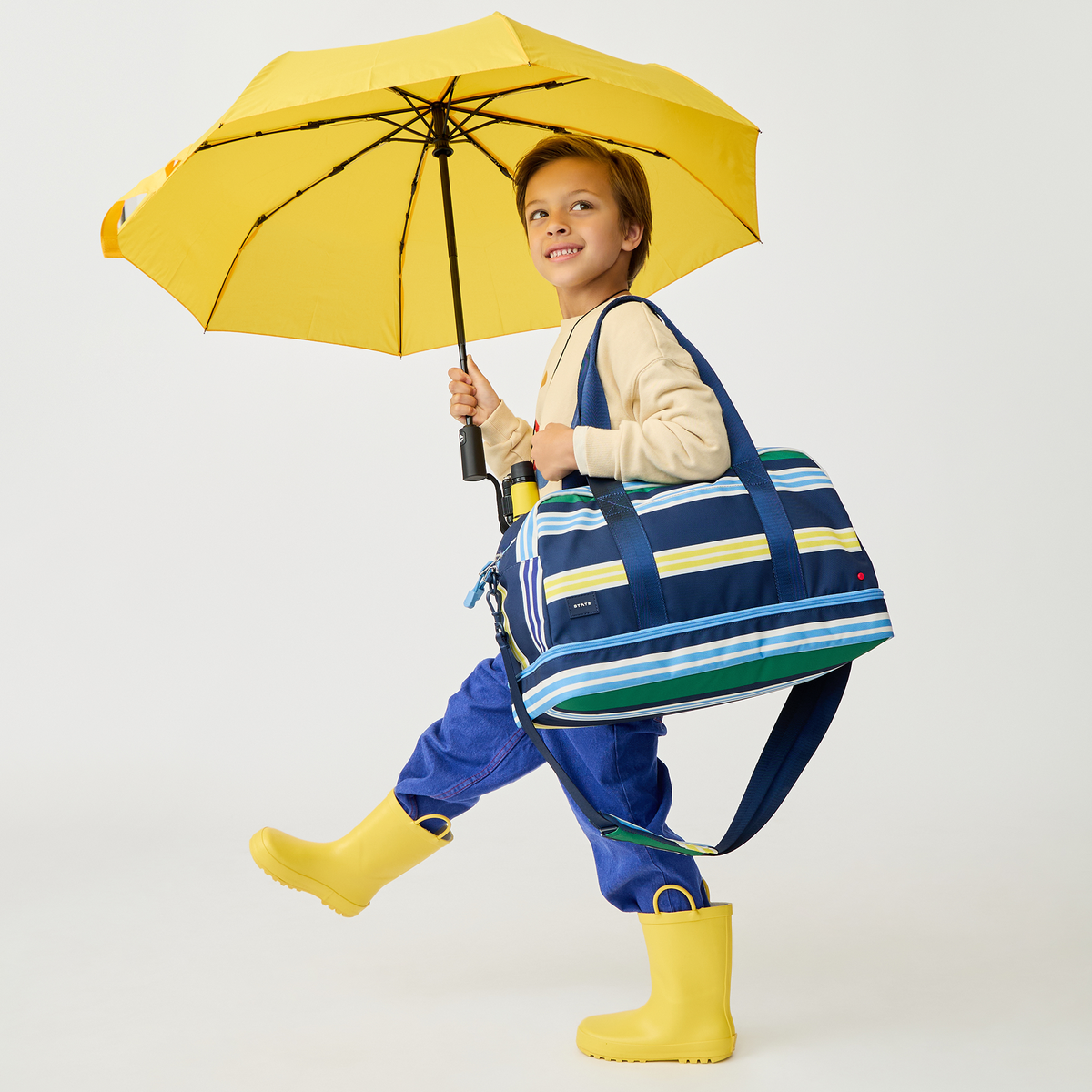 Boy Wearing Wren Weekender Polo Stripe